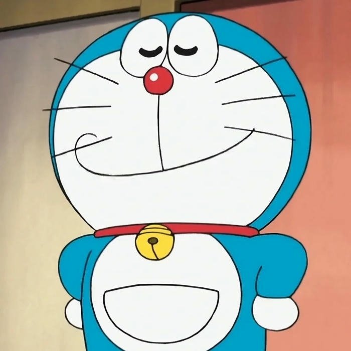 Ảnh nền Doraemon vui nhộn nhìn thẳng với khuôn mặt tròn trịa xinh