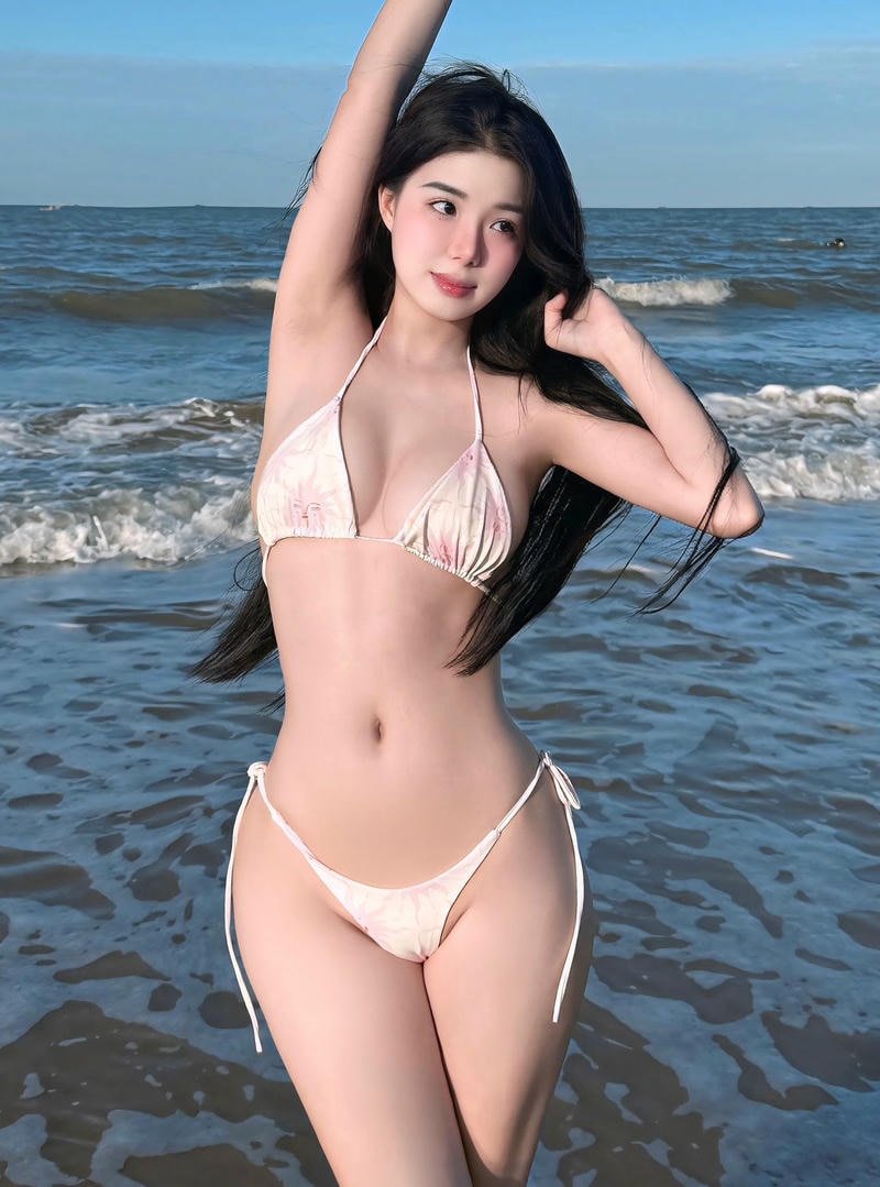 Hình trà hạ ly bikini tạo dáng cạnh hồ bơi ngoài trời